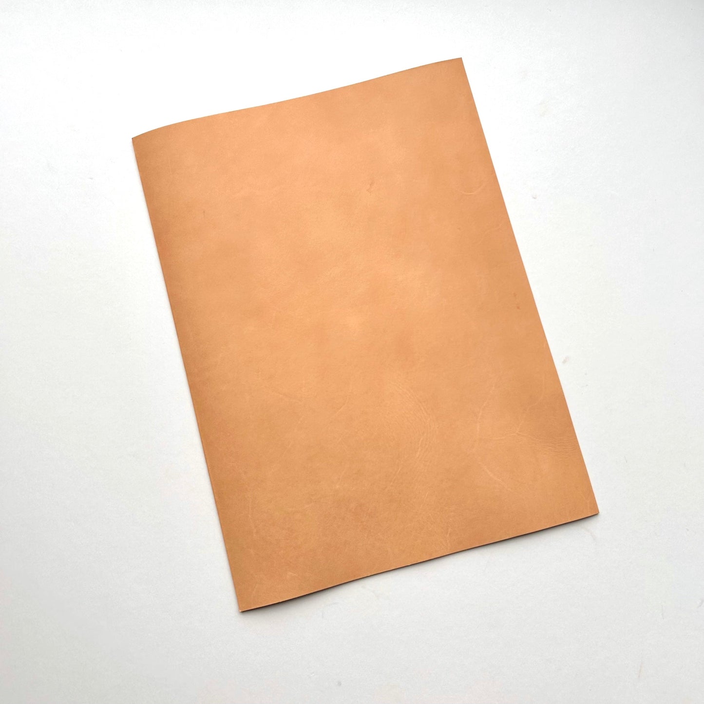 Three pieces of natural leather on a white background