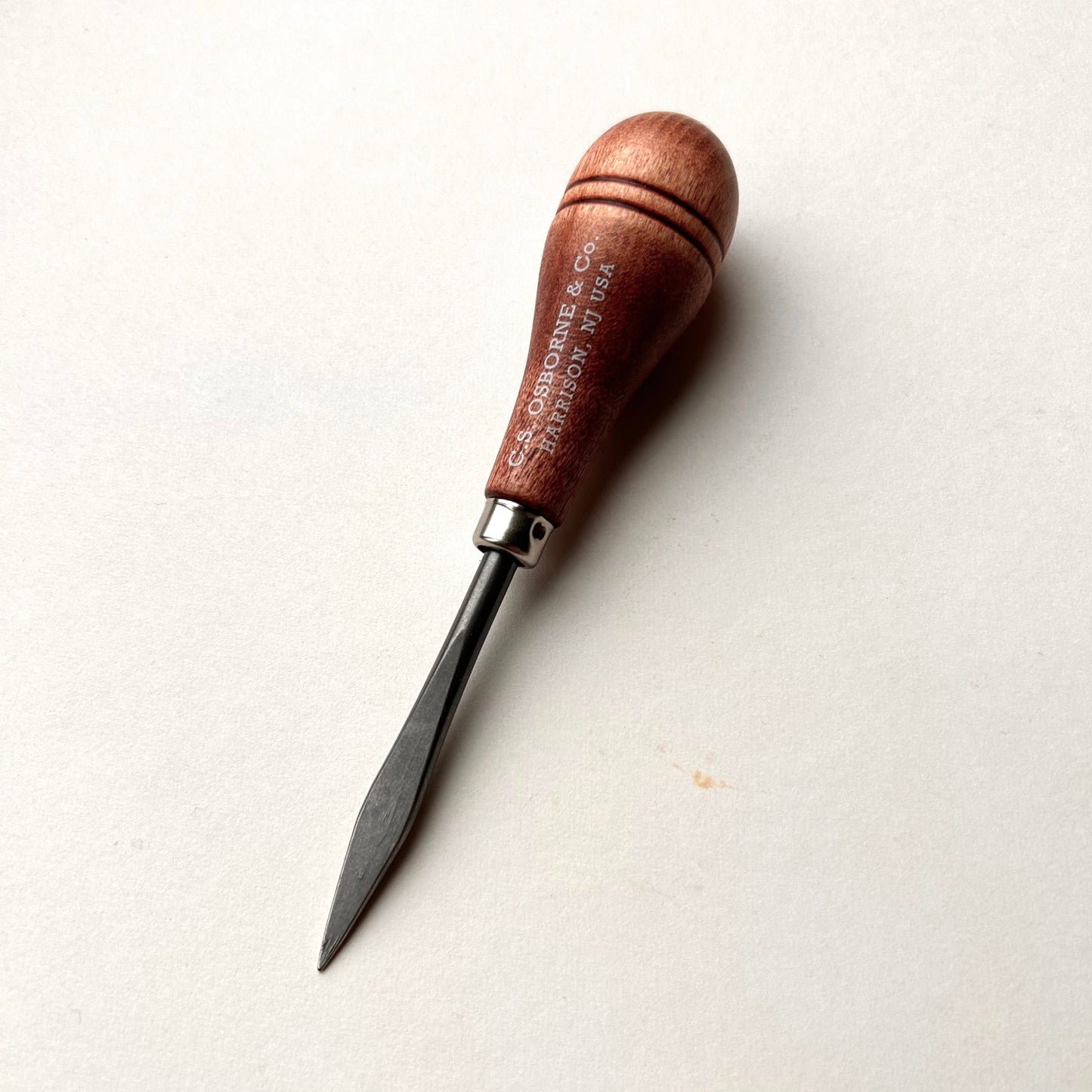 CS Osborne wooden-handled belt awl on a white background