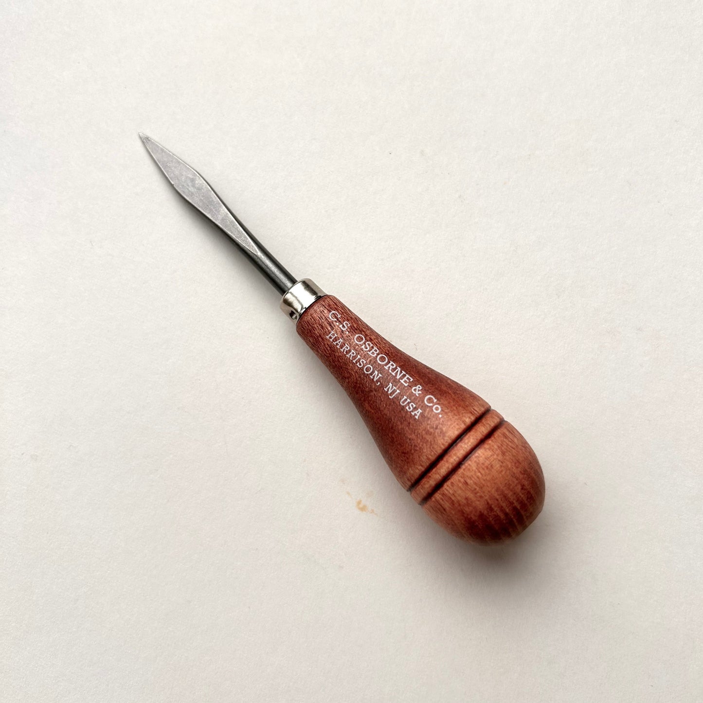 CS Osborne wooden-handled belt awl on a white background