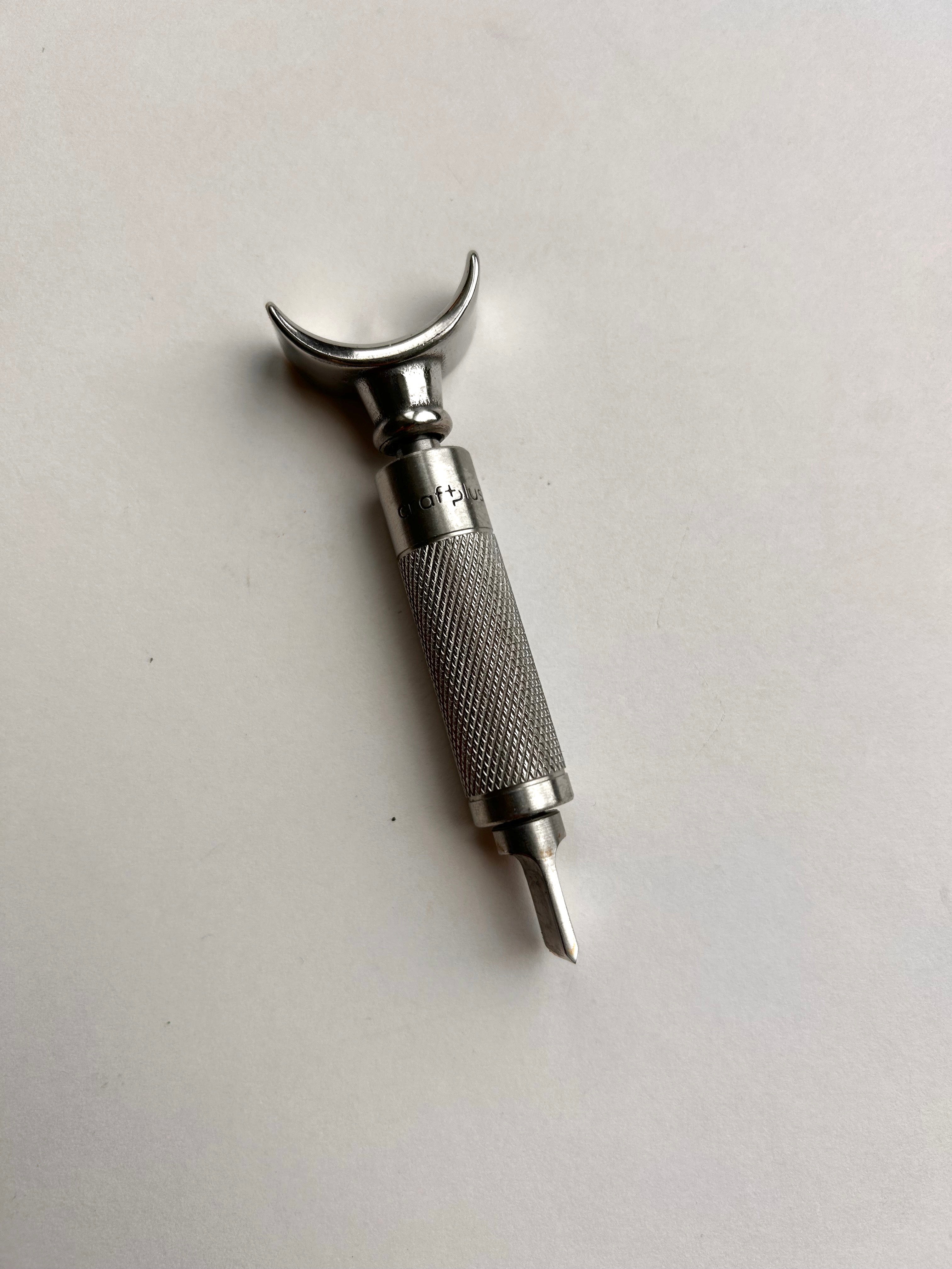 Leather carving swivel knife tool in silver colour stainless steel.