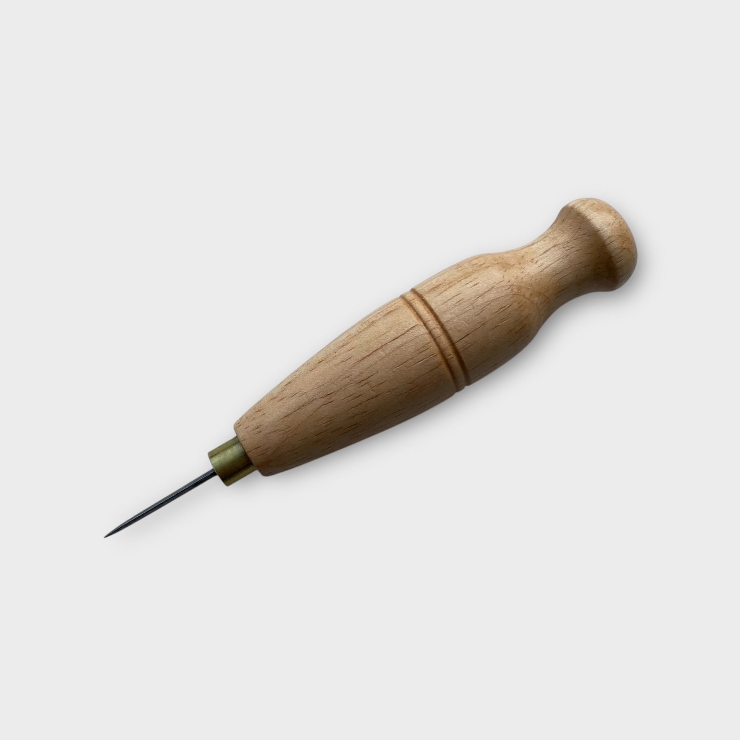 Wooden-handled diamond stitching leather awl on a white background