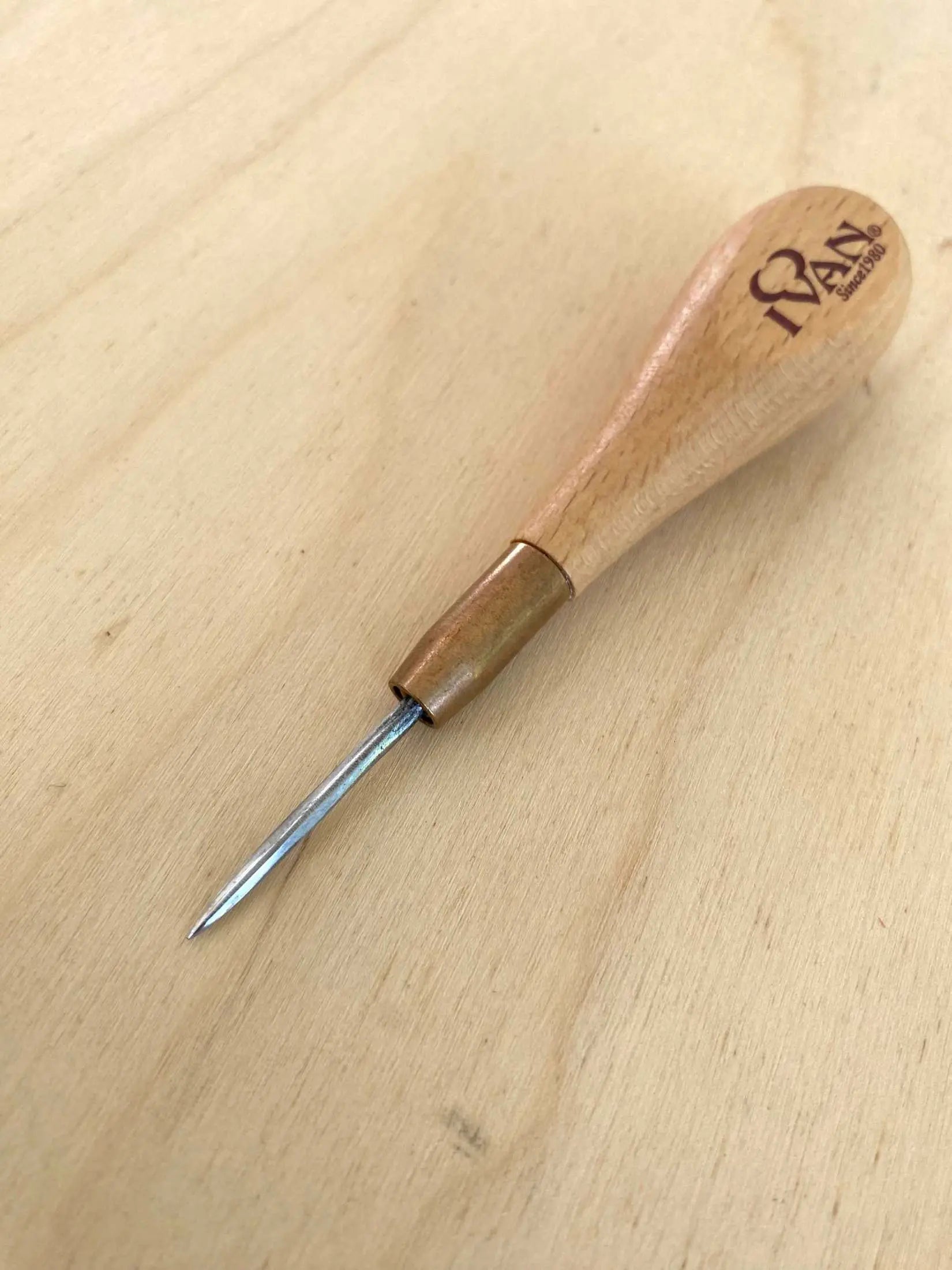 Diamond Leather Stitching Awl with Small Handle on Wooden Surface