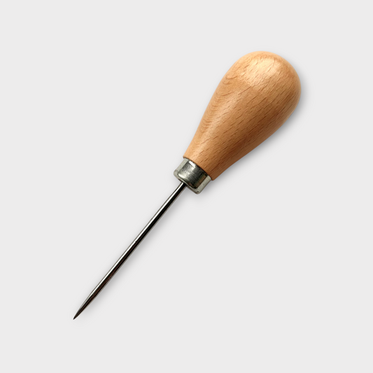 Wooden-handled awl on a white background