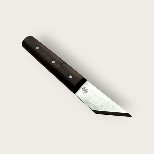 Knife with a wooden handle on a light gray background