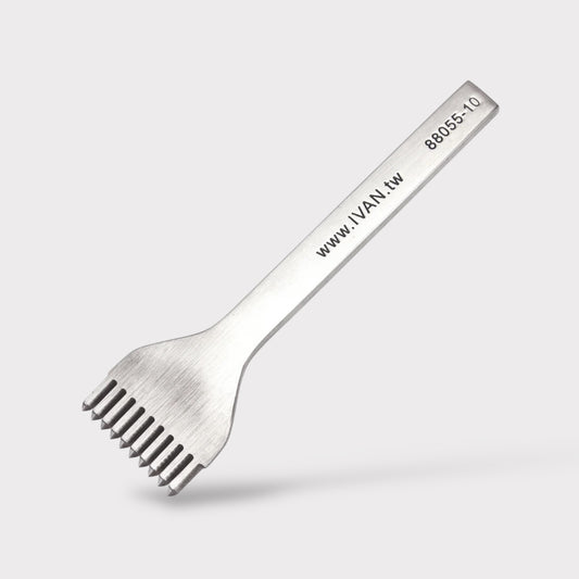 Stainless steel leather stitching punch with engraved IVAN text on a light grey background