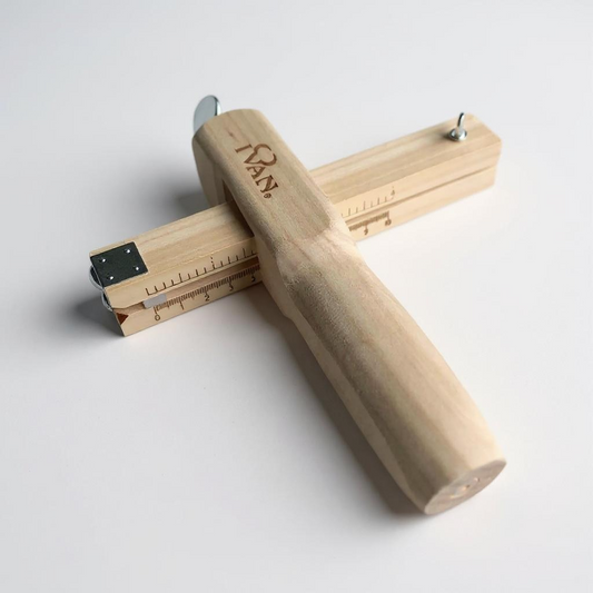 Wooden leather strap cutter tool with an Ivan brand logo on a white background