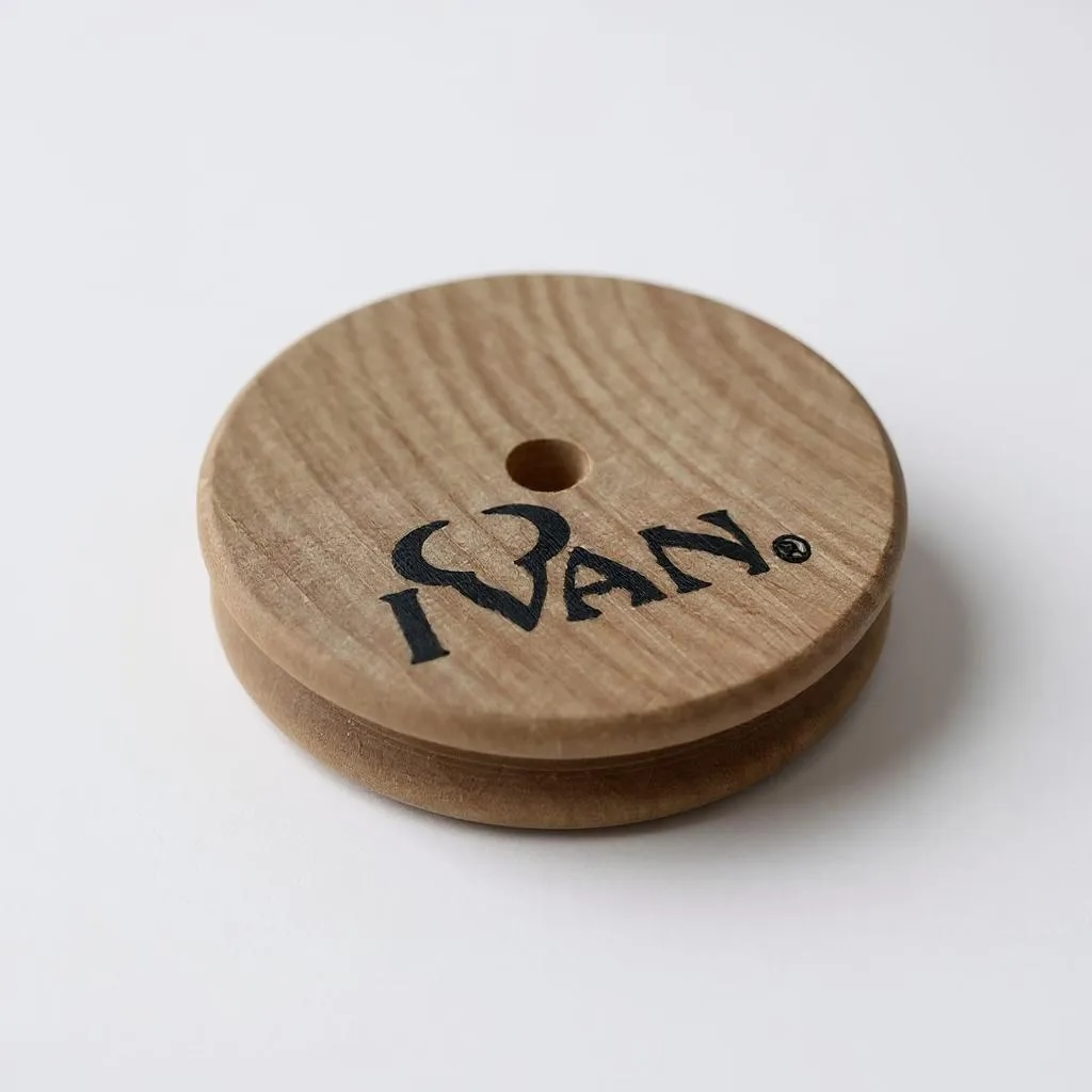 Wooden disc leather edge burnisher tool with 'IVAN' branding on a white background