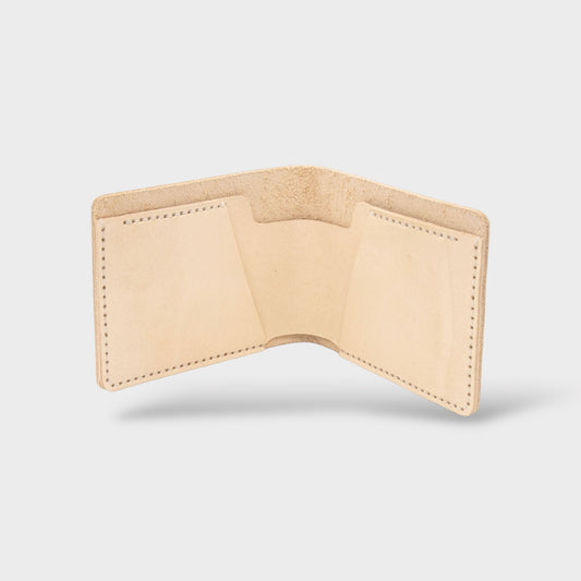 Beige leather wallet on a light gray background