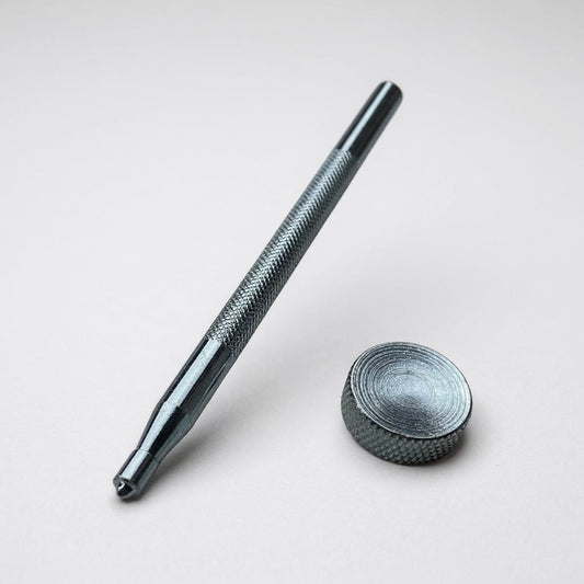 Popper snap fastener setter tool kit on a light grey background