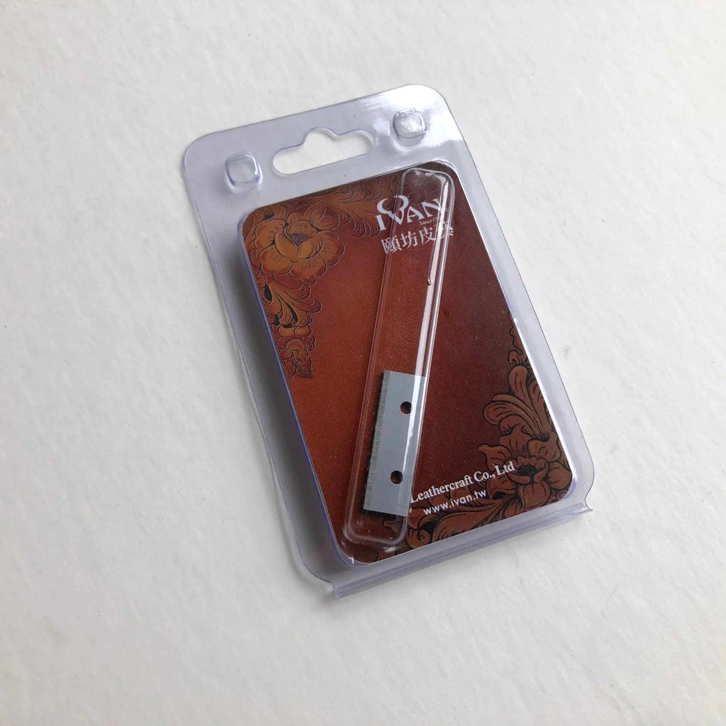 Replacement blades for leather strap cutter in packaging for precision cutting.