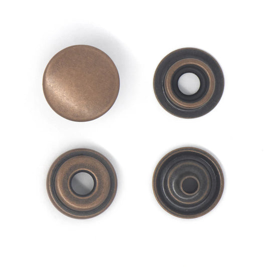 Four bronze-coloured popper snaps on a white background