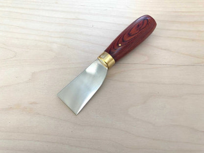 Stainless Steel Japanese Leather Skiving Knife with a wooden handle for leather crafting.
