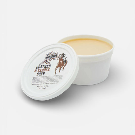 White container of leather and saddle soap with a lid on a white background