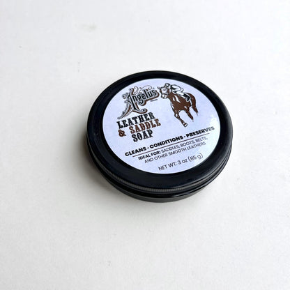 Leather and saddle soap container on a white background