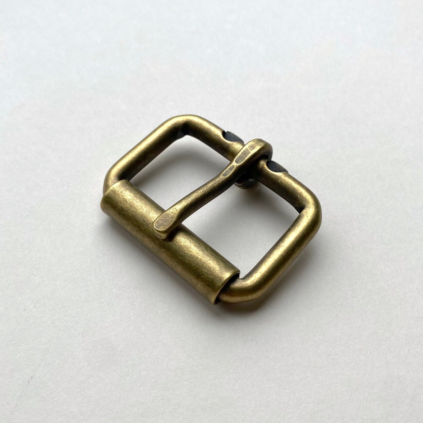 Bronze belt buckle on a white background