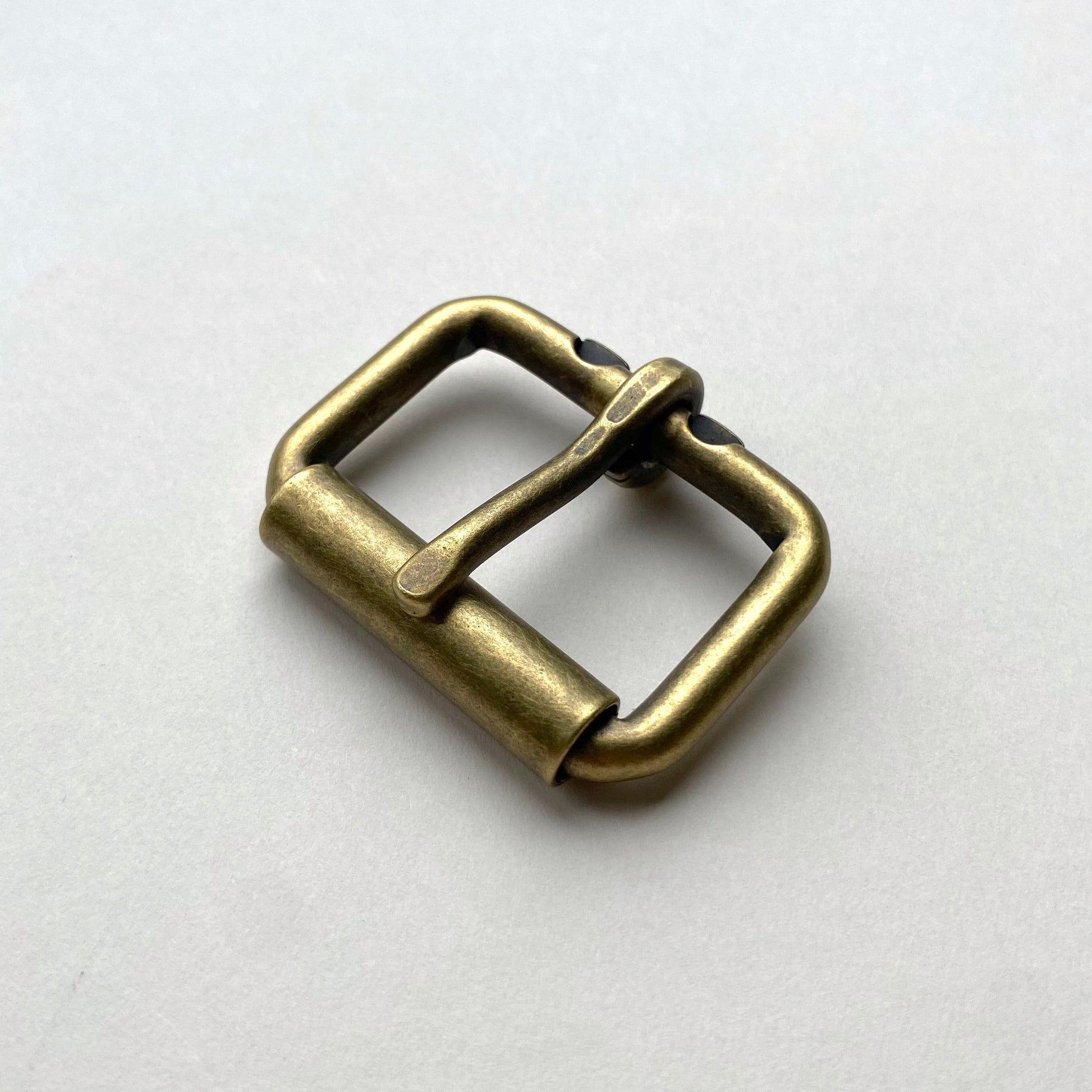 Bronze belt buckle on a white background