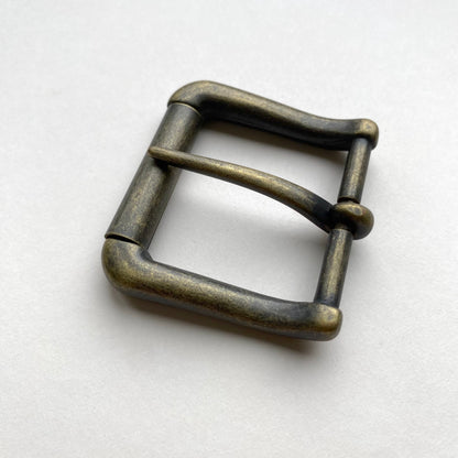 Bronze metal buckle on a white background