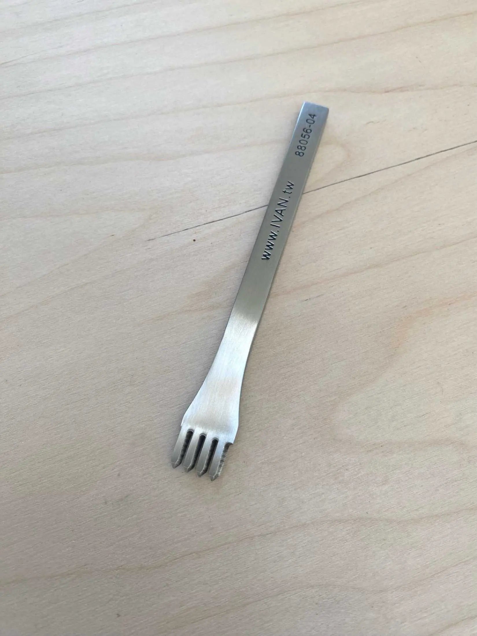Fine Stainless Steel Leather Stitching Punch with 4 prongs for leatherworking.