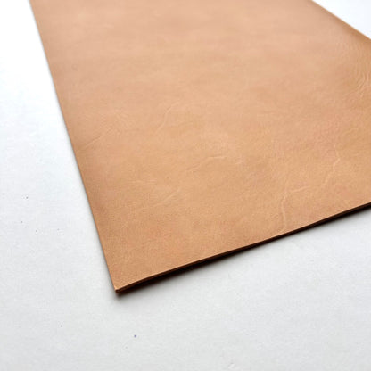 Three pieces of natural leather on a white background
