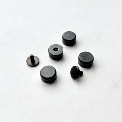 Set of Gun Metal bag feet studs on a white background