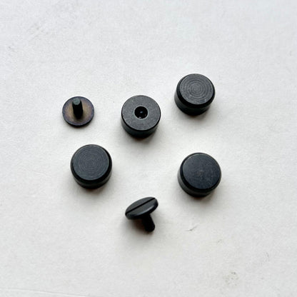 Set of Gun Metal bag feet studs on a white background