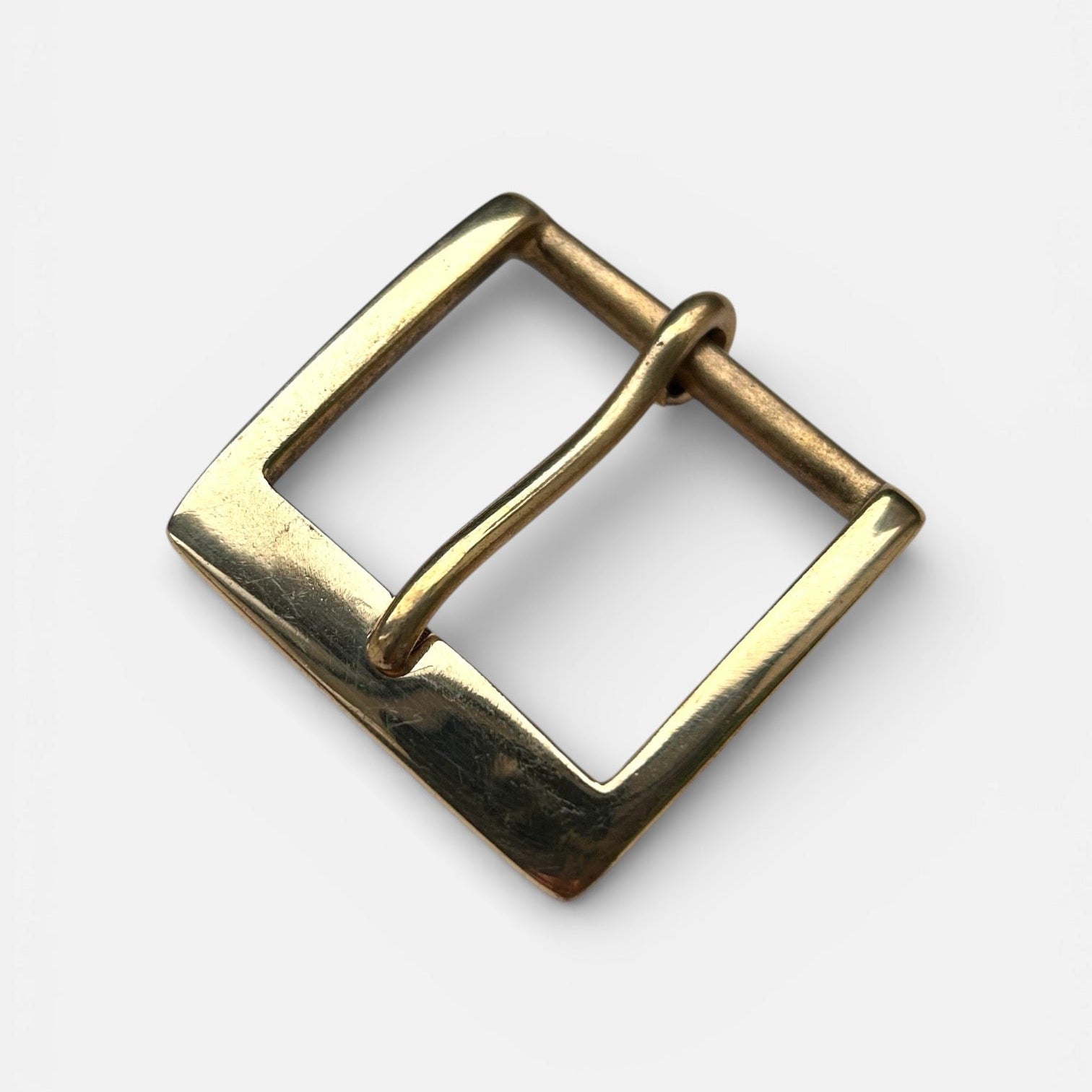Brass buckle solid frame and pin style on white background