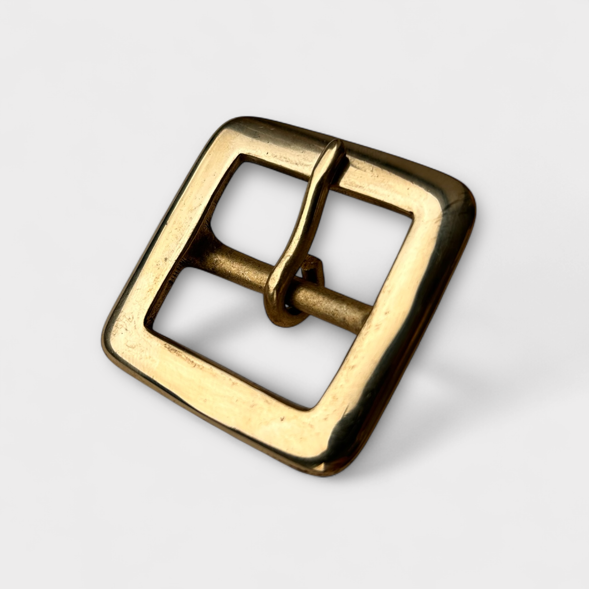 Solid Brass centre bar style buckle with a rounded end in frame and pin style. 
