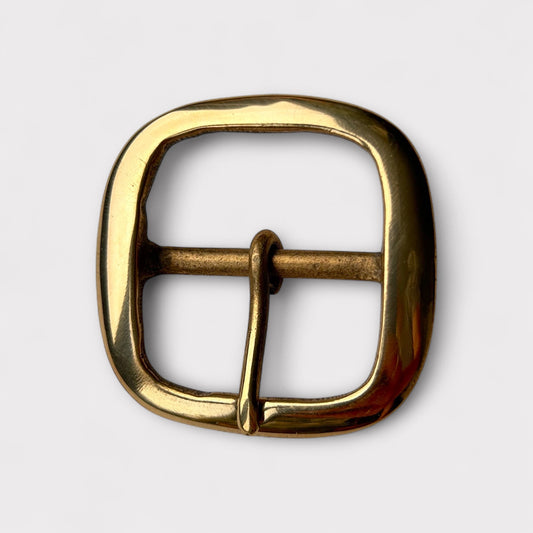 Large gold coloured brass metal buckle with a centre bar on a white background.