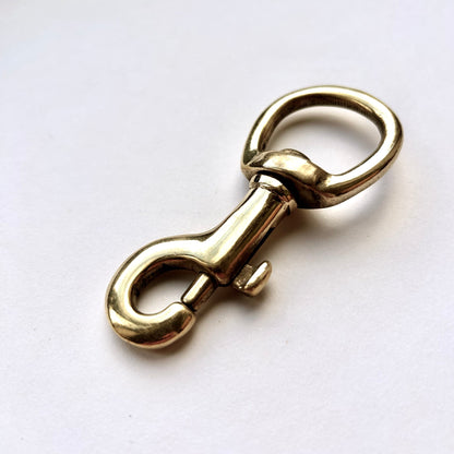 Gold metal clasp on a white background