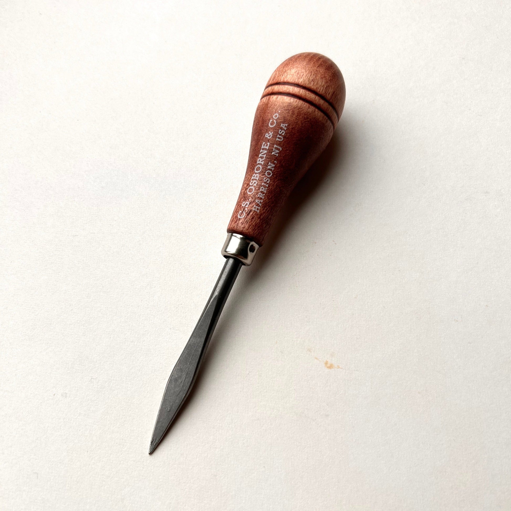 CS Osborne wooden-handled belt awl on a white background