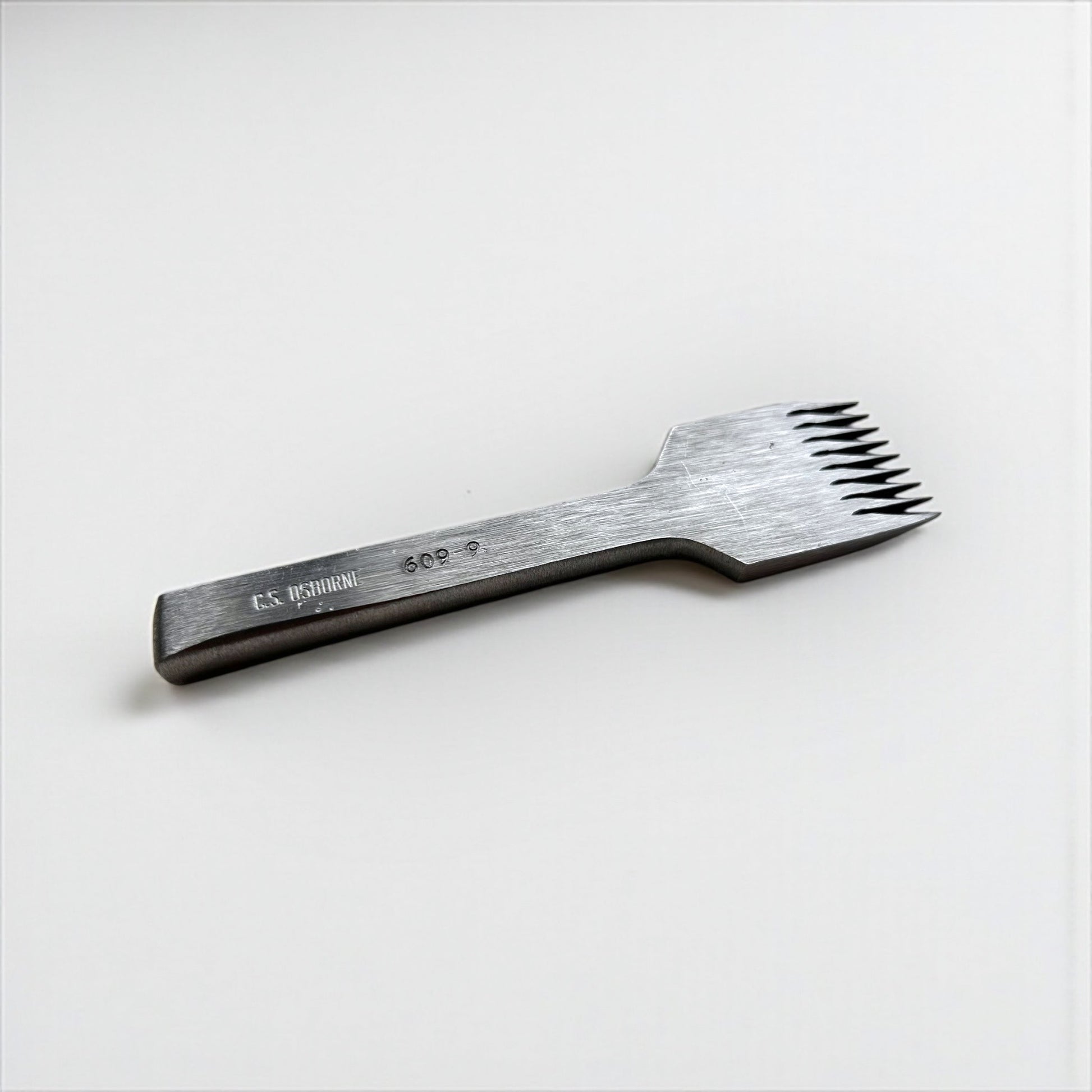 CS Osborne steel leather pricking irons metal tool with teeth on a white background