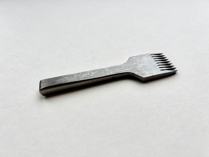 CS Osborne steel leather pricking irons metal tool with teeth on a white background