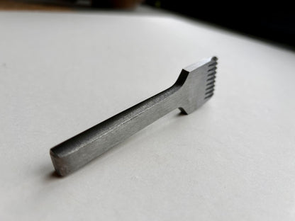 CS Osborne steel leather pricking irons metal tool with teeth on a white background