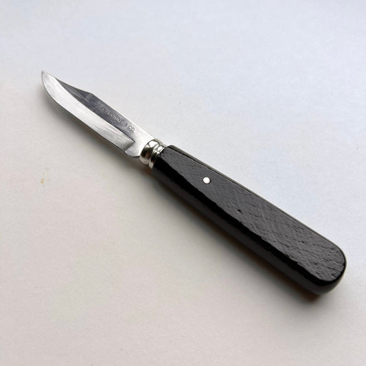 Small sloyd whittling knife with a black handle on a white background