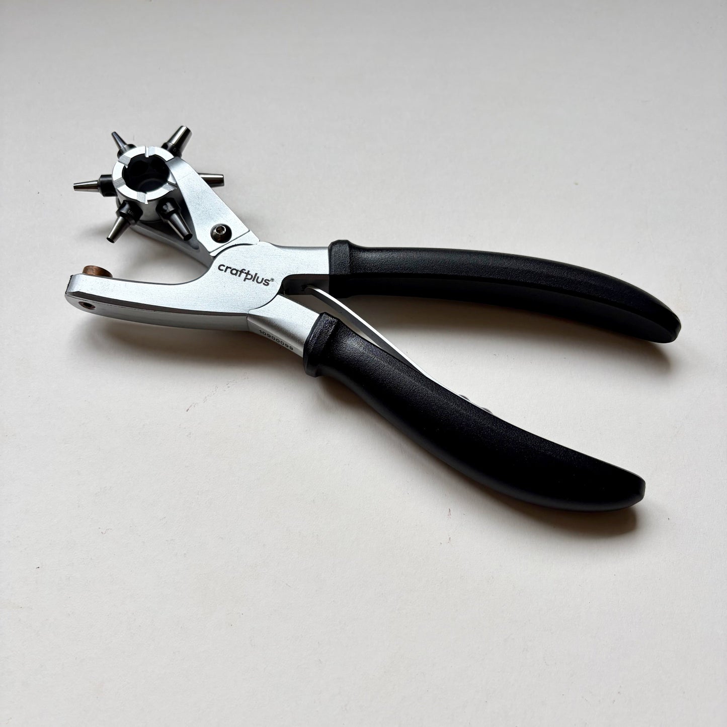 Craftplus Rotary hole punch on a grey background