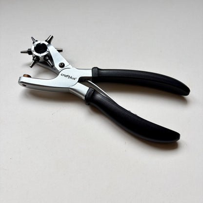 Craftplus Rotary hole punch on a grey background