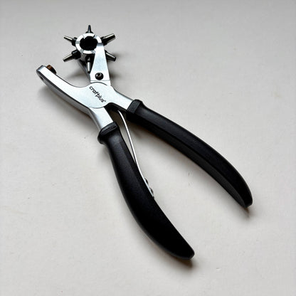 Craftplus Rotary hole punch on a grey background