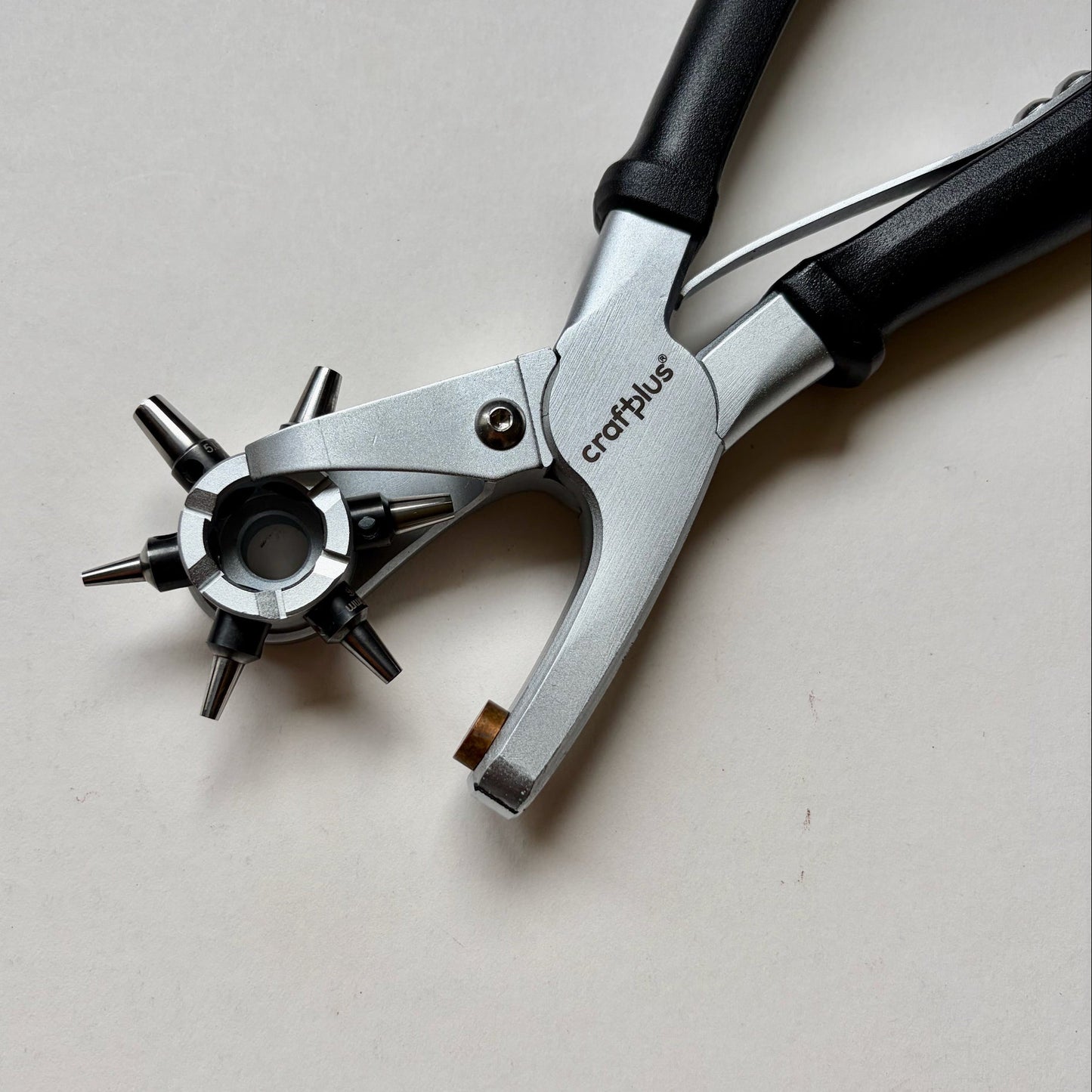 Craftplus Rotary hole punch on a grey background