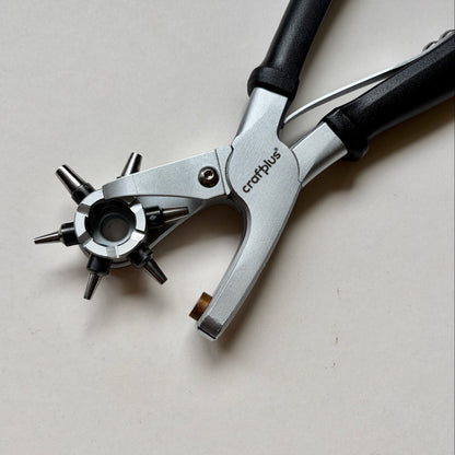 Craftplus Rotary hole punch on a grey background