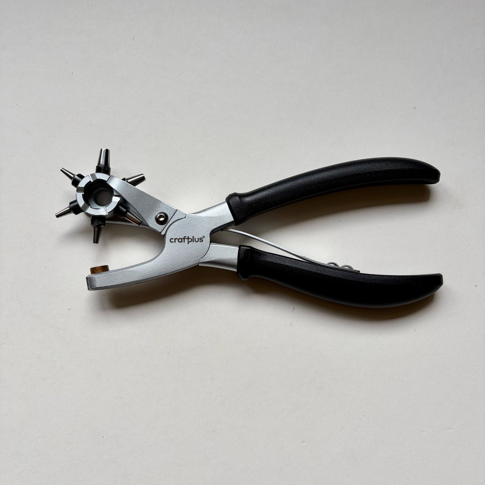 Craftplus Rotary hole punch on a grey background