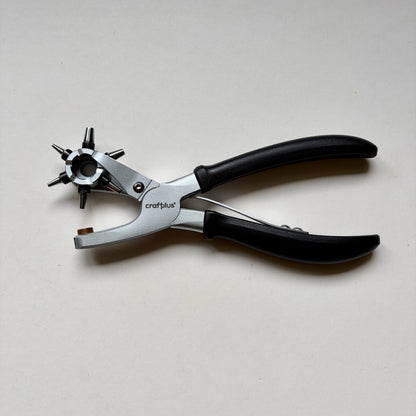 Craftplus Rotary hole punch on a grey background
