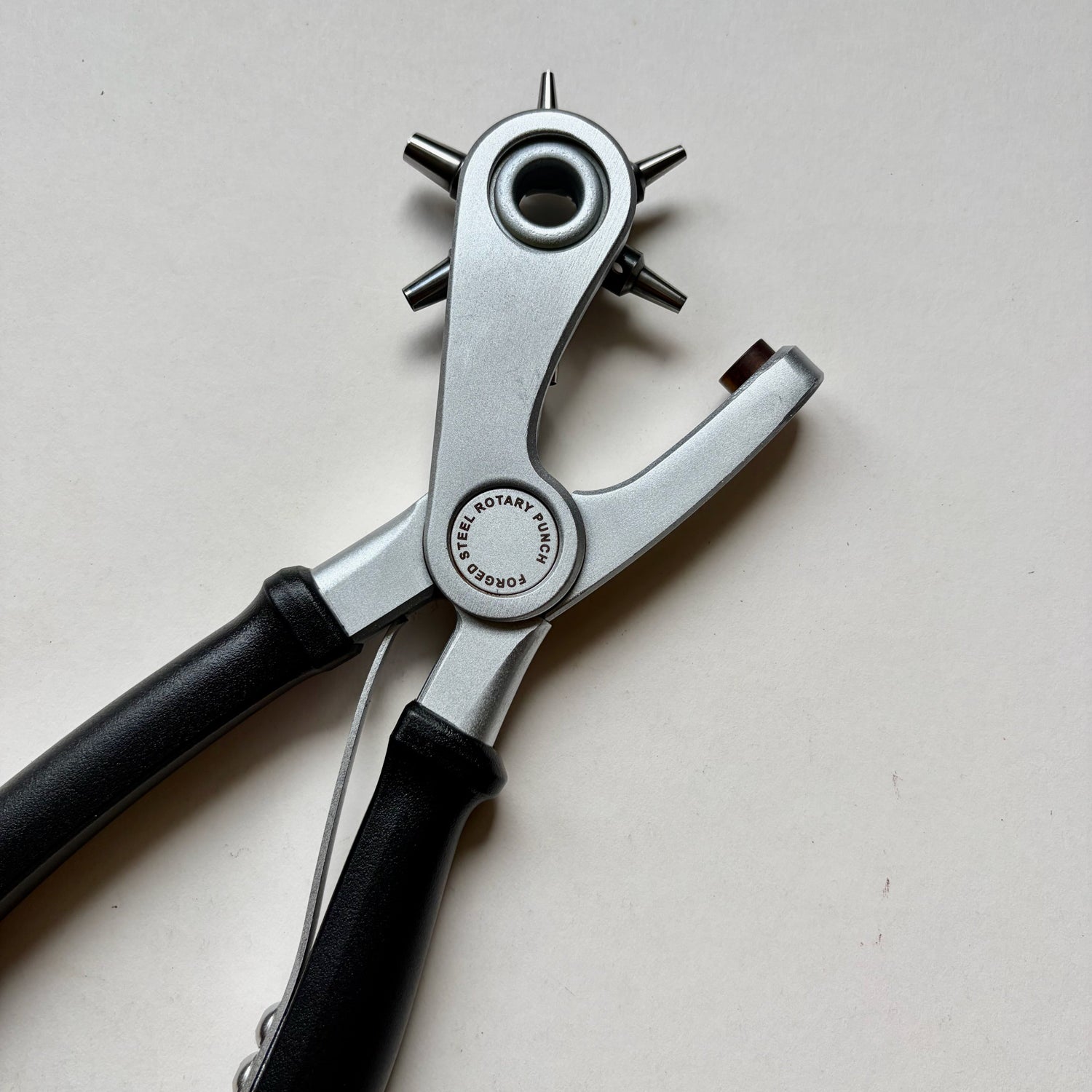 Craftplus Rotary hole punch on a grey background