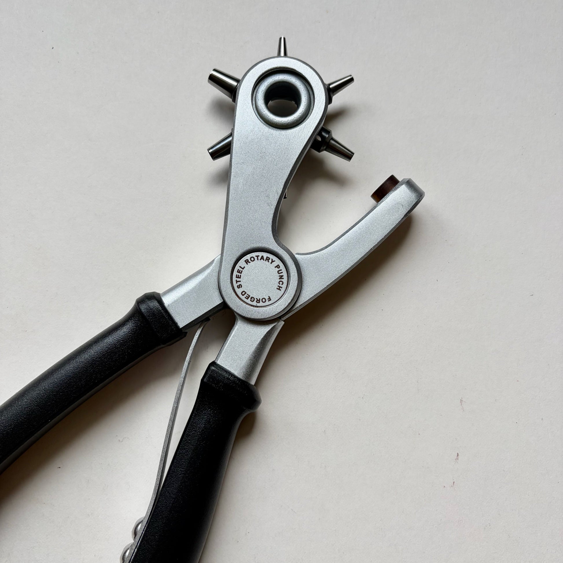 Craftplus Rotary hole punch on a grey background