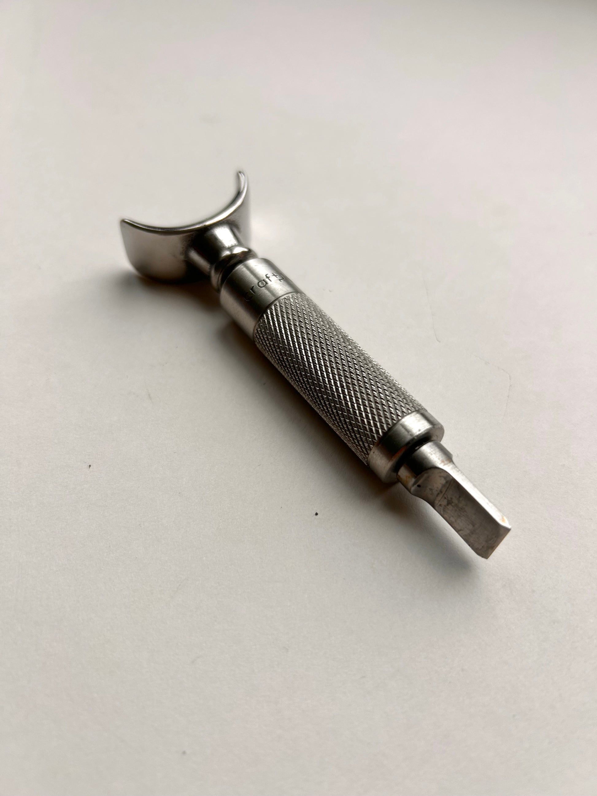 Leather carving swivel knife tool in silver colour stainless steel.