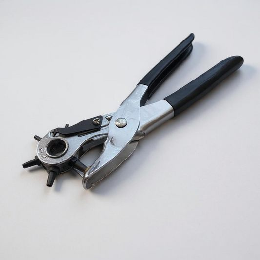 Deluxe leather rotary hole punch tool on white background