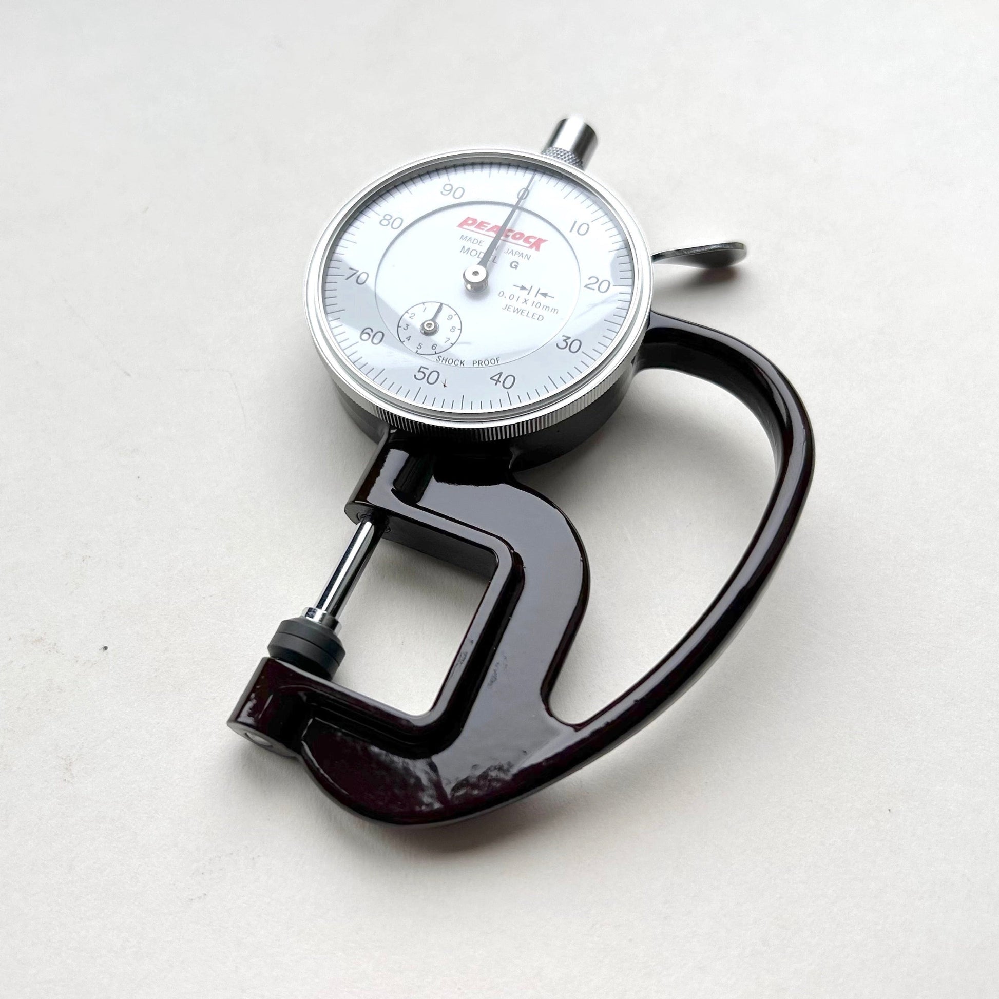 Dial Thickness Gauge for Leather on white background