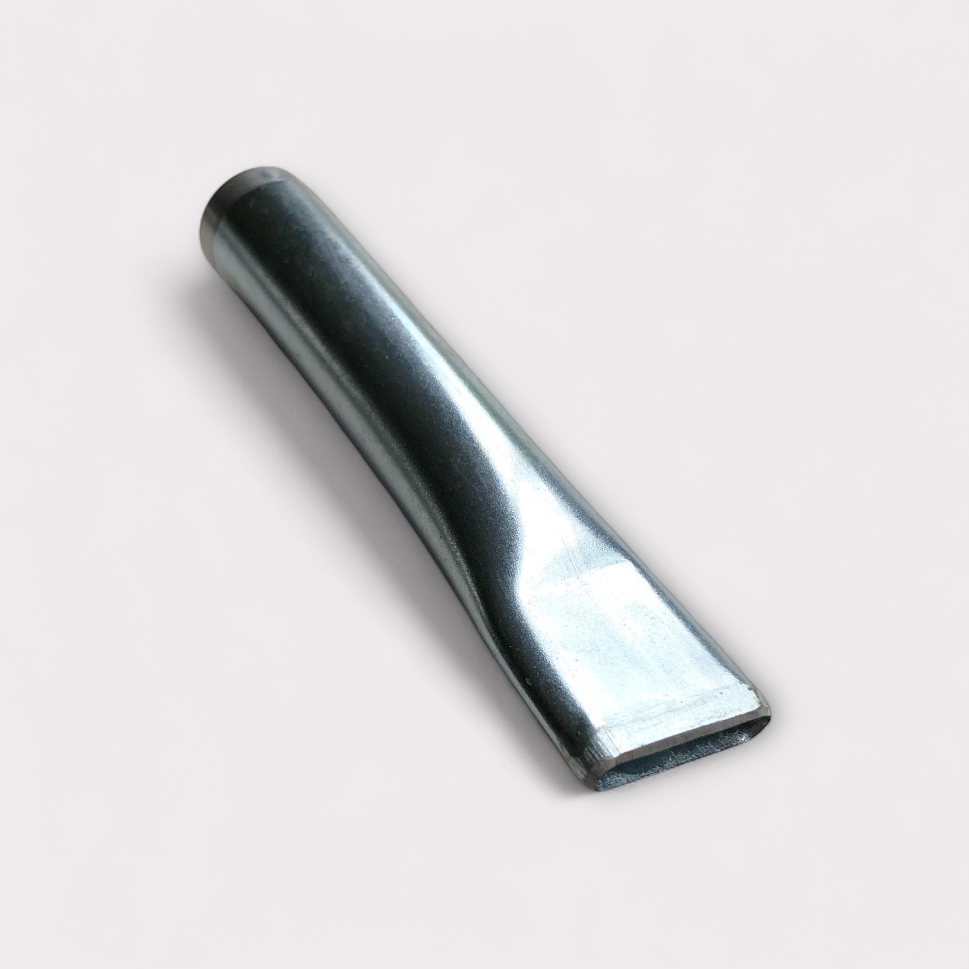 Silver coloured leather belt slot punch tool on white background.