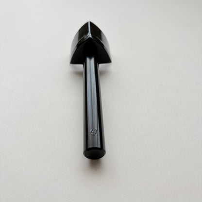 A black metal strap end punch with a long shank, photographed on a plain light grey background.