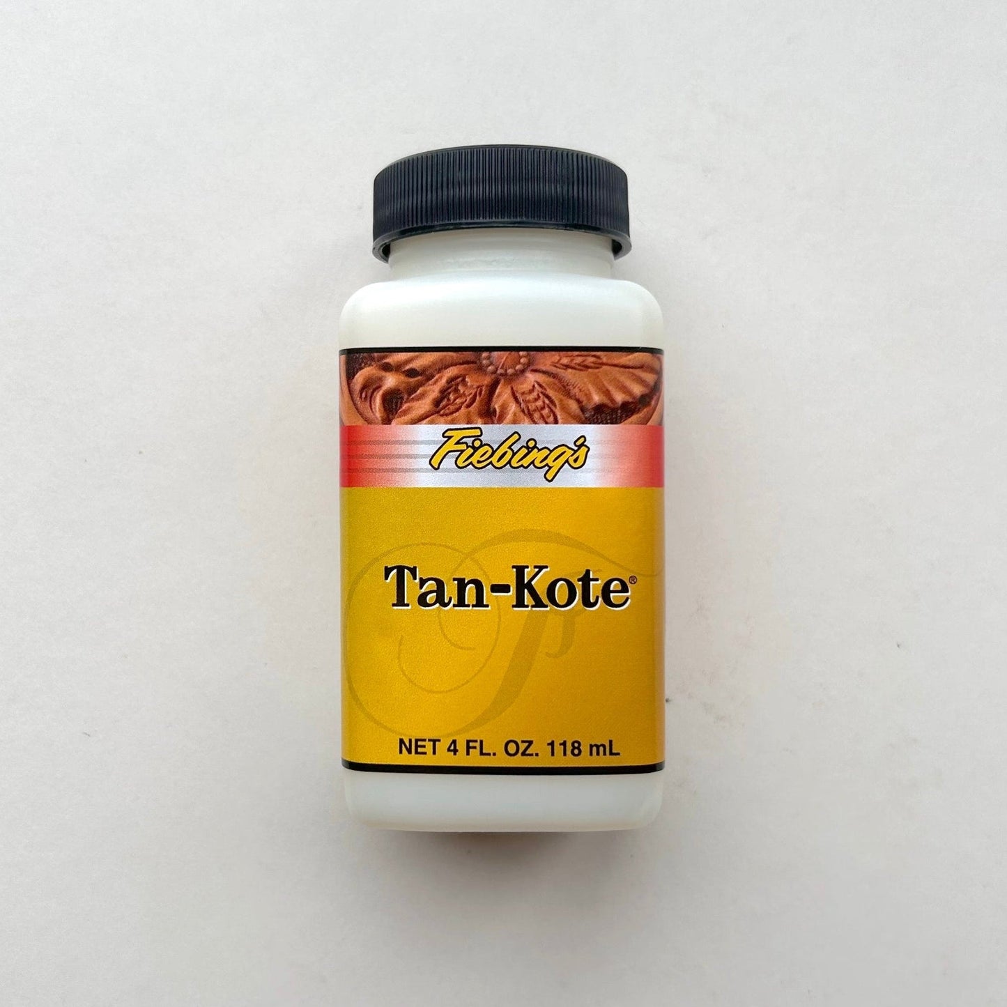 Bottle of Tan-Kote on a white background