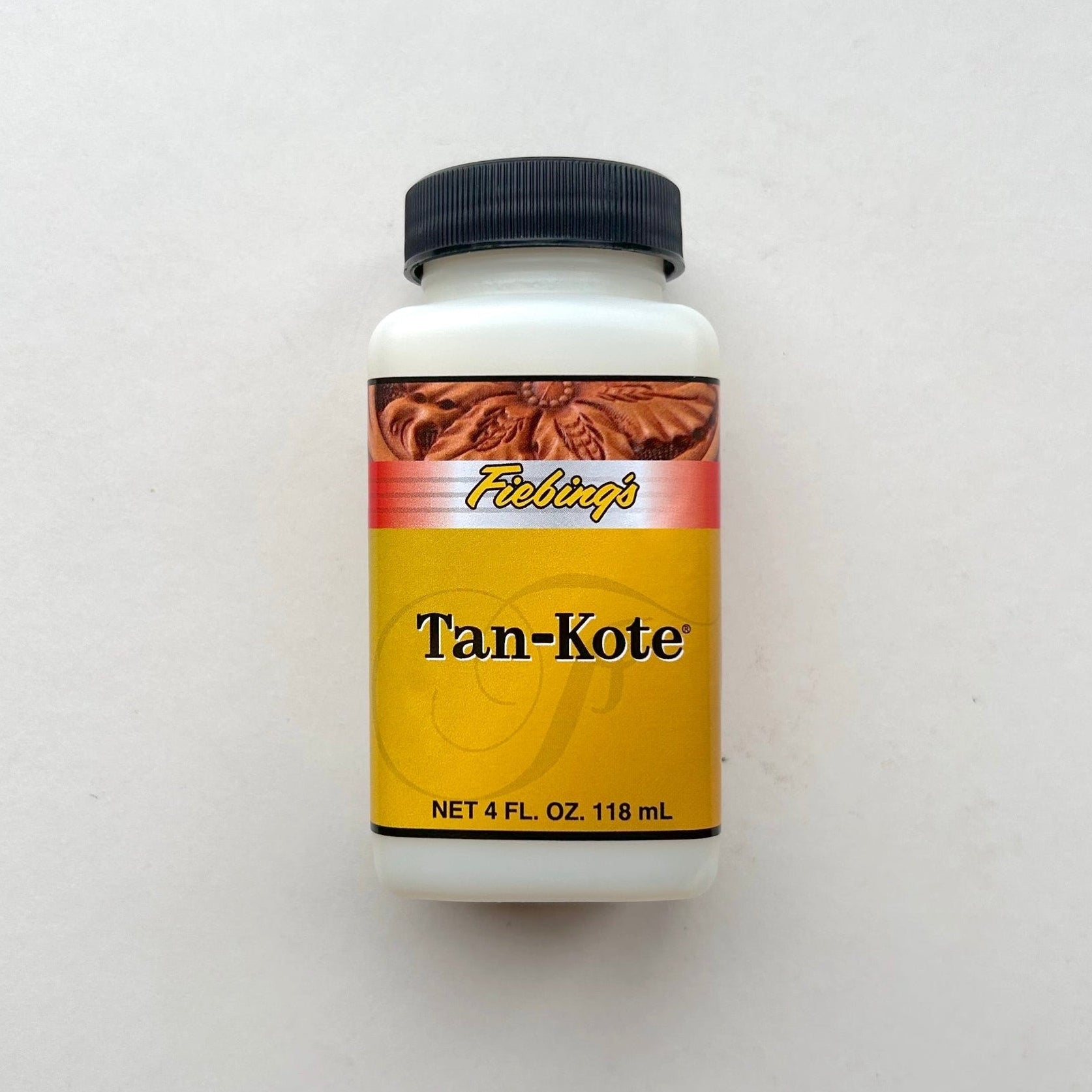 Bottle of Tan-Kote on a white background
